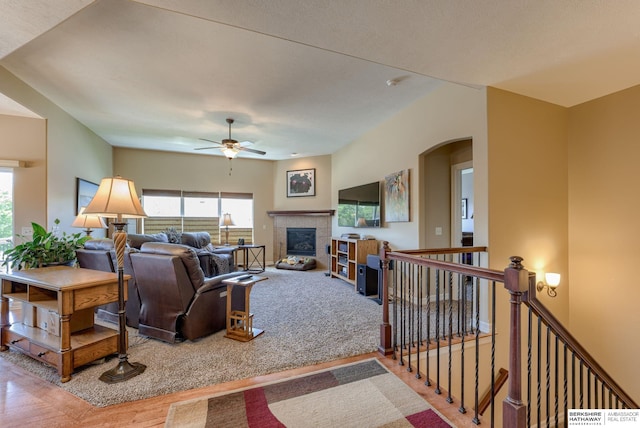 18855 Mason Plz, Omaha, NE 68022 - living room with plenty of natural light, ceiling fan, arched walkways, and a tile fireplace