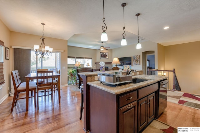 18855 Mason Plz, Omaha, NE 68022 - kitchen featuring light wood-style floors, baseboards, dishwasher, a ceiling fan, and recessed lighting
