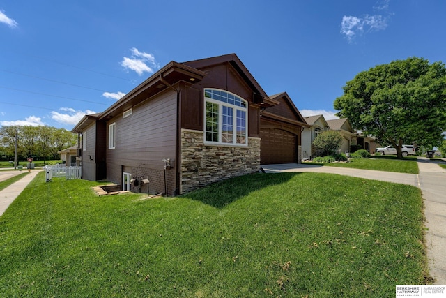 18855 Mason Plz, Omaha, NE 68022 - view of side of property featuring a garage, driveway, and a lawn
