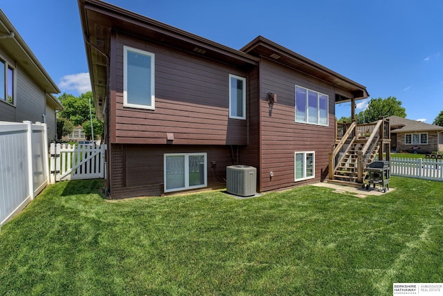 18855 Mason Plz, Omaha, NE 68022 - back of property with central AC, stairway, and a gate