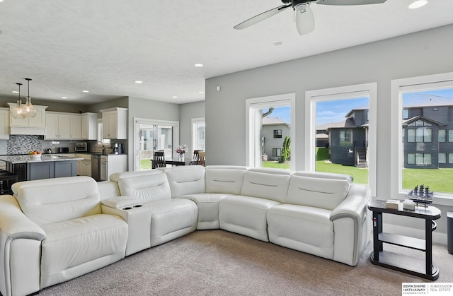 20956 Pine Cir, Elkhorn, NE 68022 - living room featuring ceiling fan, light carpet, and recessed lighting