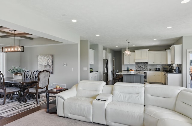 20956 Pine Cir, Elkhorn, NE 68022 - living area featuring wood finished floors, recessed lighting, and a chandelier