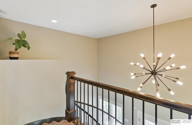 20956 Pine Cir, Elkhorn, NE 68022 - stairs featuring a chandelier and recessed lighting