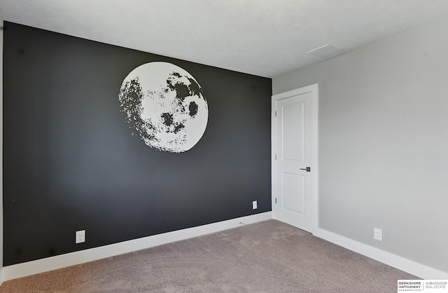20956 Pine Cir, Elkhorn, NE 68022 - spare room with carpet flooring and baseboards