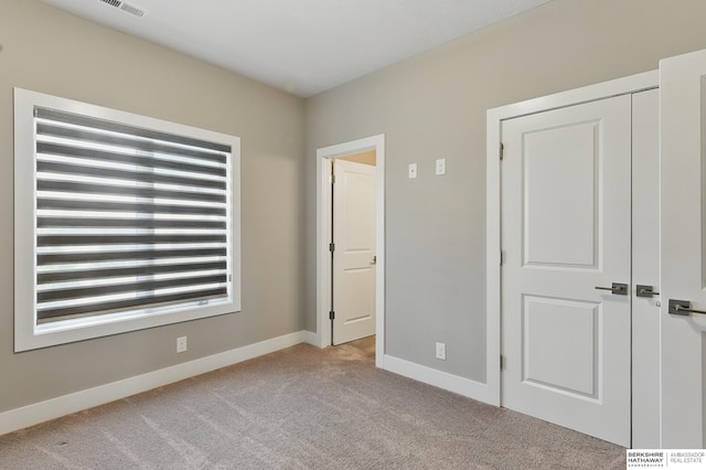 20956 Pine Cir, Elkhorn, NE 68022 - unfurnished bedroom featuring carpet flooring and baseboards