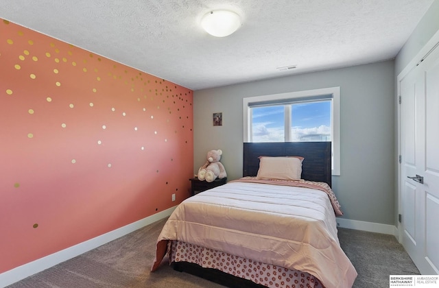 20956 Pine Cir, Elkhorn, NE 68022 - bedroom with carpet floors, baseboards, and a textured ceiling