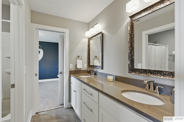 20956 Pine Cir, Elkhorn, NE 68022 - bathroom featuring double vanity, baseboards, and tile patterned floors