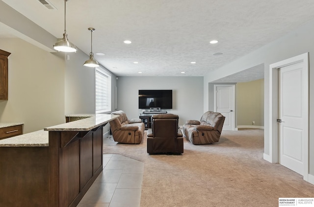 20956 Pine Cir, Elkhorn, NE 68022 - living area featuring light carpet, recessed lighting, and baseboards