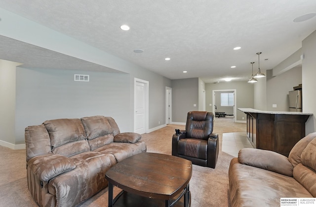 20956 Pine Cir, Elkhorn, NE 68022 - living room featuring light colored carpet, baseboards, and recessed lighting