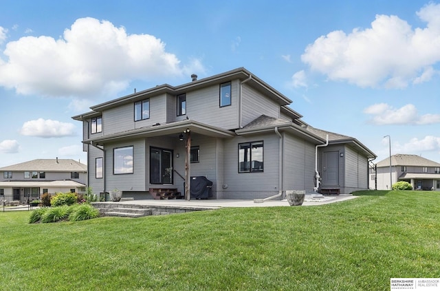 20956 Pine Cir, Elkhorn, NE 68022 - back of property featuring a patio and a lawn