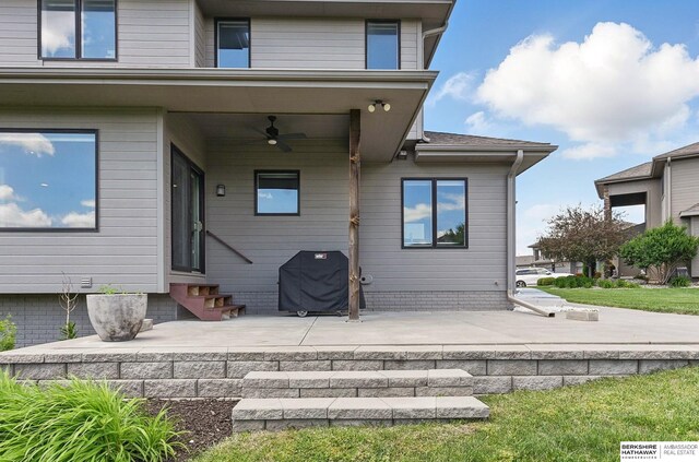 20956 Pine Cir, Elkhorn, NE 68022 - back of house featuring entry steps, a ceiling fan, and a patio