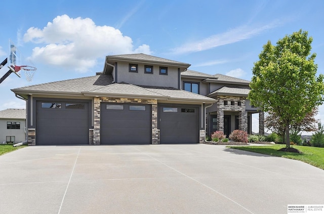 20956 Pine Cir, Elkhorn, NE 68022 - prairie-style home featuring stone siding, concrete driveway, an attached garage, and stucco siding