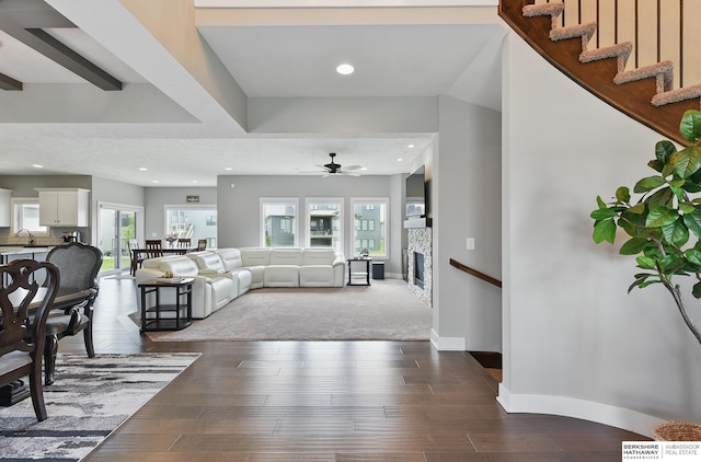 20956 Pine Cir, Elkhorn, NE 68022 - living area featuring a ceiling fan, a fireplace, recessed lighting, baseboards, and wood finished floors