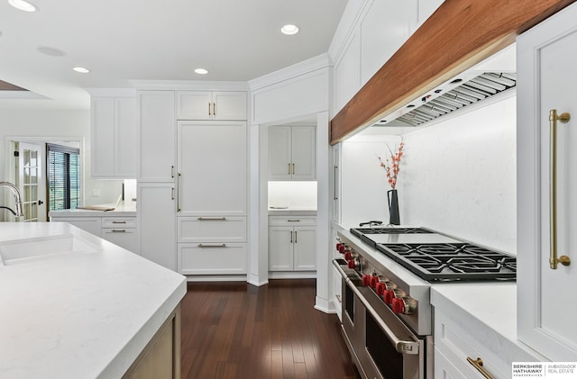 2025 S 189th Cir, Omaha, NE 68130 - kitchen with range with two ovens, a sink, custom range hood, light countertops, and white cabinets