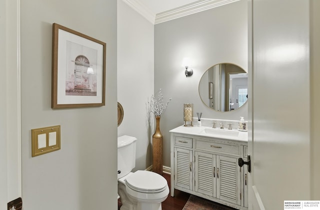 2025 S 189th Cir, Omaha, NE 68130 - bathroom featuring toilet, ornamental molding, vanity, baseboards, and wood finished floors