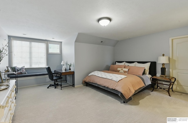 2025 S 189th Cir, Omaha, NE 68130 - bedroom featuring light carpet, a desk, baseboards, and lofted ceiling