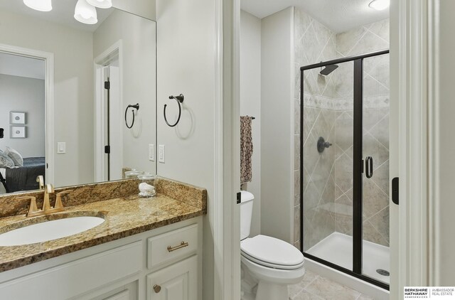 2025 S 189th Cir, Omaha, NE 68130 - bathroom with ensuite bath, a stall shower, toilet, vanity, and tile patterned floors