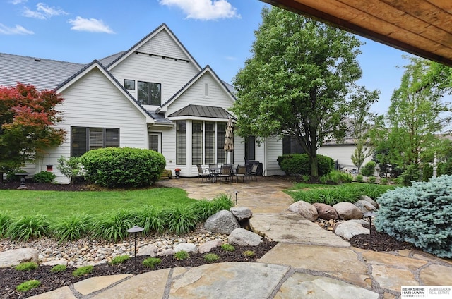 2025 S 189th Cir, Omaha, NE 68130 - rear view of property featuring a patio, a standing seam roof, and metal roof