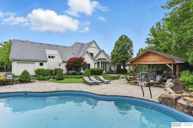 2025 S 189th Cir, Omaha, NE 68130 - outdoor pool with a gazebo, a patio, and a fire pit
