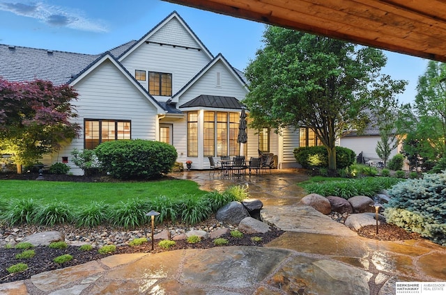2025 S 189th Cir, Omaha, NE 68130 - rear view of property featuring a patio area, a standing seam roof, metal roof, and a yard