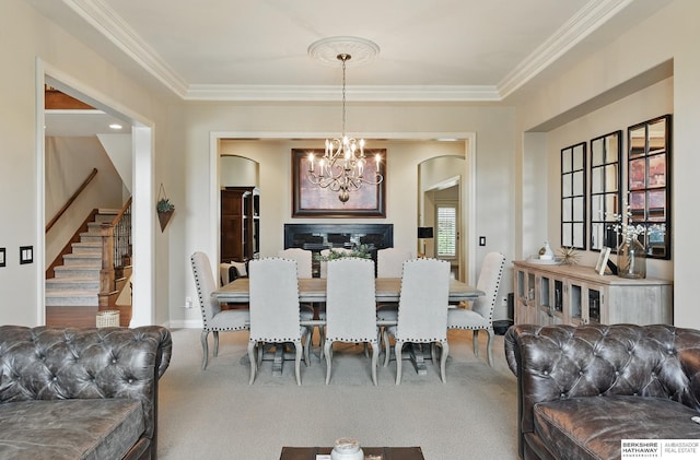 2025 S 189th Cir, Omaha, NE 68130 - dining space with a chandelier, stairway, crown molding, carpet, and arched walkways