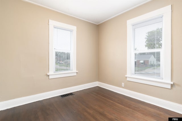 6935 Binney St, Omaha, NE 68104 - unfurnished room featuring baseboards, dark wood-style floors, and crown molding