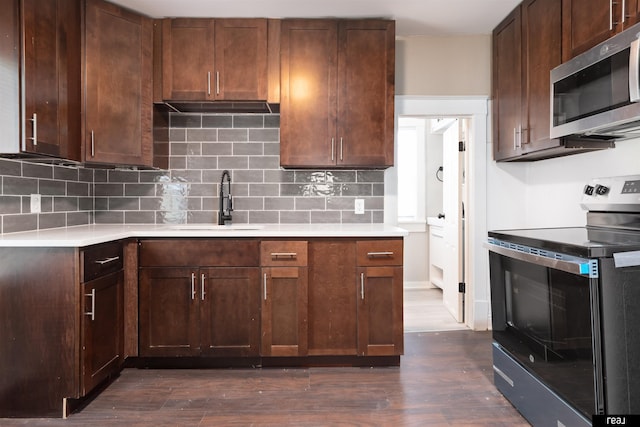 6935 Binney St, Omaha, NE 68104 - kitchen with appliances with stainless steel finishes, a sink, light countertops, and tasteful backsplash