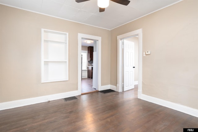 6935 Binney St, Omaha, NE 68104 - spare room featuring a ceiling fan, crown molding, baseboards, wood finished floors, and built in shelves