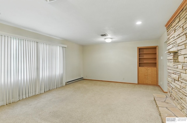 2417 Fairway Dr, Fremont, NE 68025 - unfurnished room with light carpet, a baseboard radiator, baseboards, and built in features