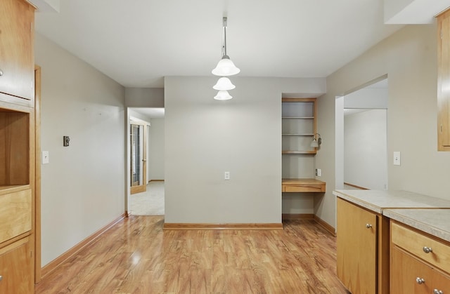 2417 Fairway Dr, Fremont, NE 68025 - unfurnished dining area featuring light wood finished floors and baseboards