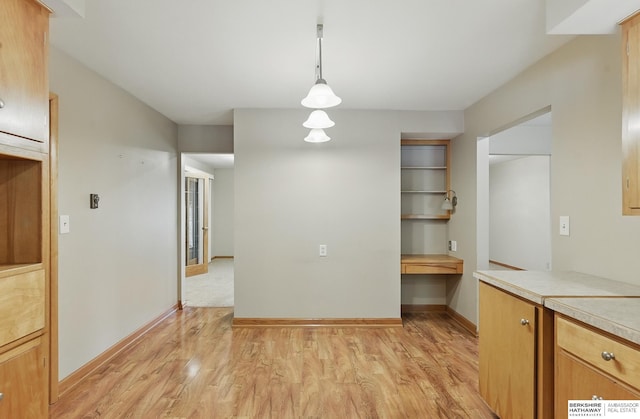 2417 Fairway Dr, Fremont, NE 68025 - unfurnished dining area featuring light wood-type flooring and baseboards