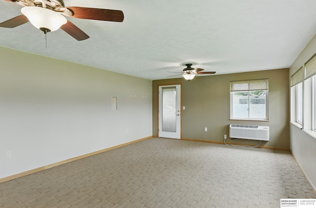 2417 Fairway Dr, Fremont, NE 68025 - unfurnished room featuring ceiling fan, an AC wall unit, light carpet, and baseboards