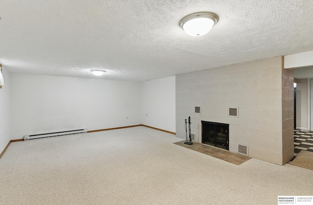 2417 Fairway Dr, Fremont, NE 68025 - finished basement featuring a baseboard radiator, a tiled fireplace, a textured ceiling, carpet, and baseboards