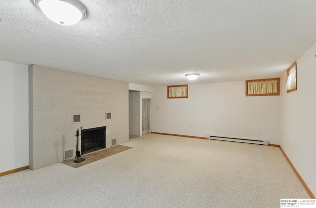 2417 Fairway Dr, Fremont, NE 68025 - finished below grade area with baseboard heating, a tiled fireplace, baseboards, and a textured ceiling