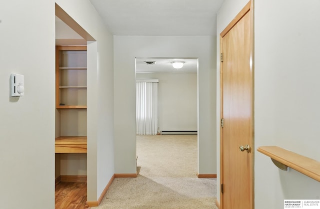 2417 Fairway Dr, Fremont, NE 68025 - corridor featuring carpet, baseboards, and a baseboard heating unit