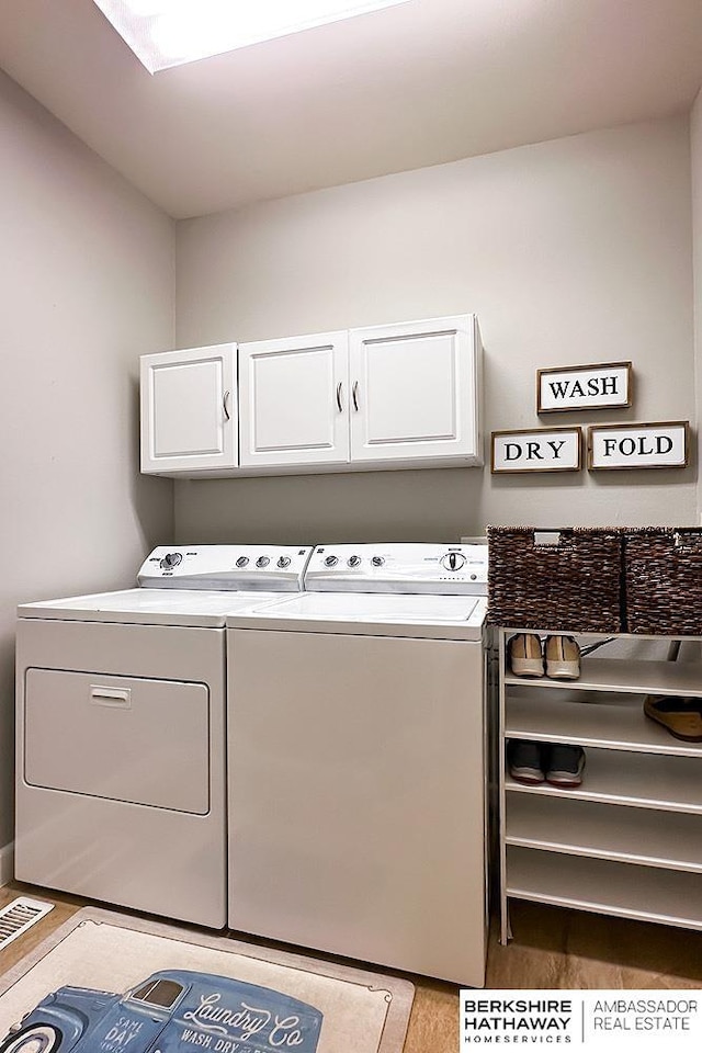 18914 C St, Omaha, NE 68130 - laundry area with cabinet space and washing machine and dryer