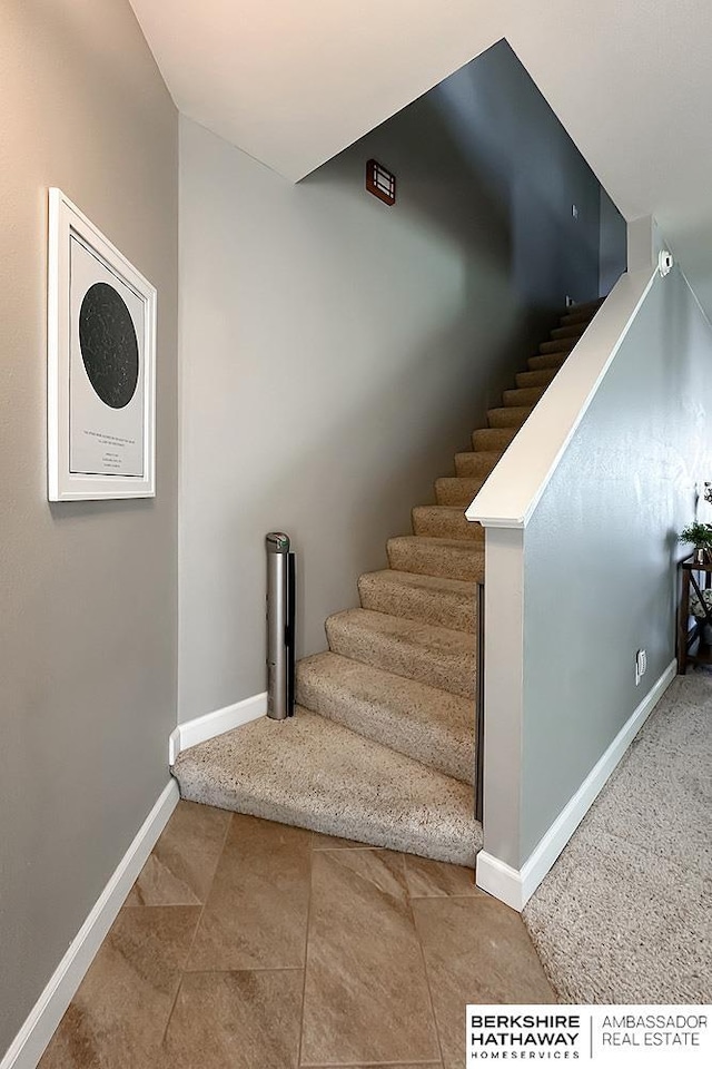 18914 C St, Omaha, NE 68130 - staircase featuring baseboards and tile patterned flooring