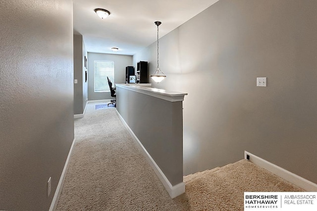 18914 C St, Omaha, NE 68130 - hall featuring carpet floors, baseboards, and an upstairs landing