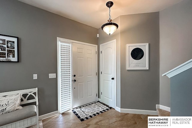 18914 C St, Omaha, NE 68130 - entryway with baseboards and tile patterned flooring