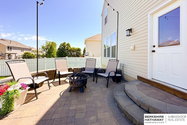 18914 C St, Omaha, NE 68130 - view of patio featuring an outdoor fire pit