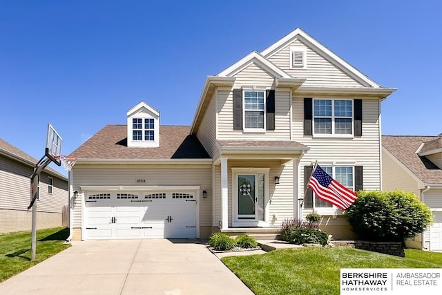 18914 C St, Omaha, NE 68130 - view of front facade with concrete driveway, a garage, a front yard, and a shingled roof