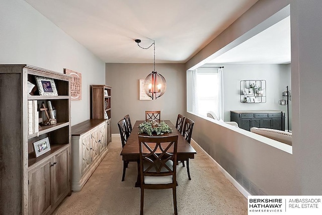 18914 C St, Omaha, NE 68130 - dining area featuring a chandelier and baseboards