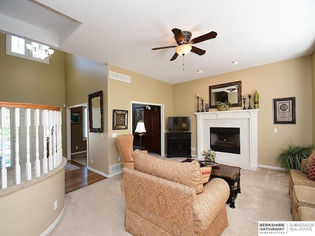 5103 N 140th St, Omaha, NE 68164 - living room featuring light colored carpet, ceiling fan, a premium fireplace, and baseboards