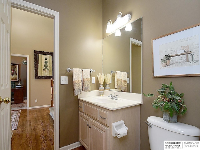 5103 N 140th St, Omaha, NE 68164 - bathroom featuring vanity, wood finished floors, and toilet