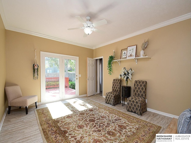 5103 N 140th St, Omaha, NE 68164 - living area with light wood-type flooring, crown molding, ceiling fan, and baseboards
