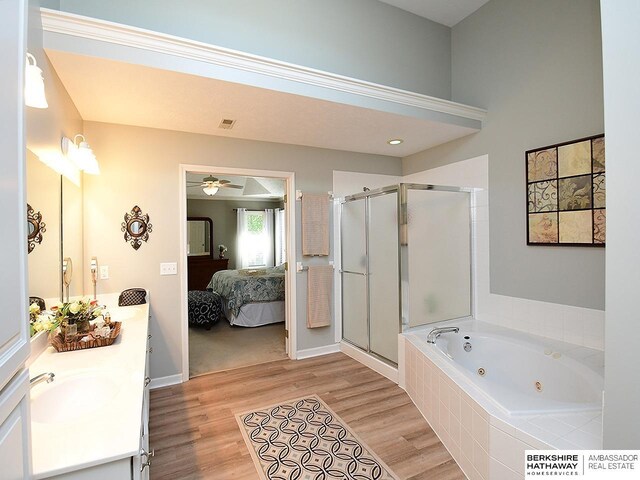 5103 N 140th St, Omaha, NE 68164 - bathroom featuring a shower stall, double vanity, a whirlpool tub, wood finished floors, and ensuite bathroom