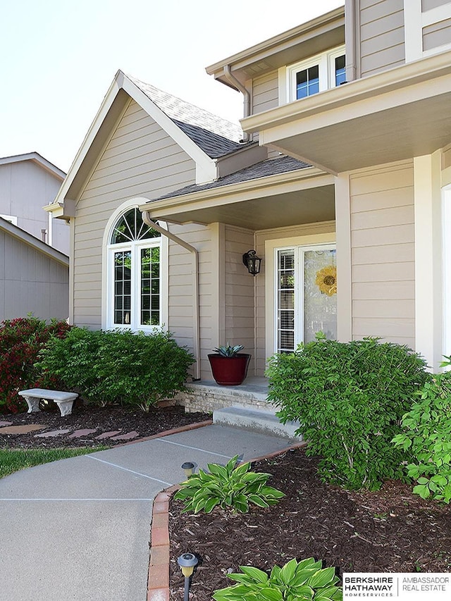 5103 N 140th St, Omaha, NE 68164 - view of exterior entry with covered porch and roof with shingles