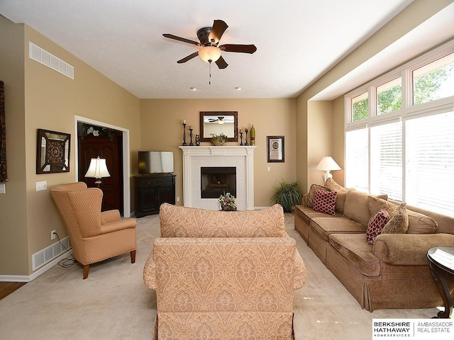 5103 N 140th St, Omaha, NE 68164 - living area with ceiling fan, light colored carpet, a fireplace, and baseboards