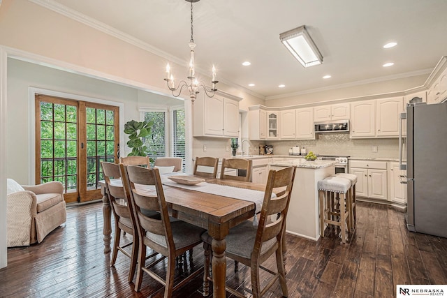 2221 S 181st Cir, Omaha, NE 68130 - dining area with dark wood-style floors, ornamental molding, a chandelier, and recessed lighting