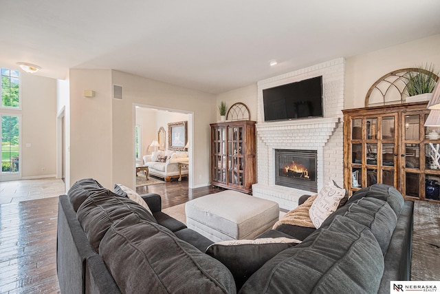 2221 S 181st Cir, Omaha, NE 68130 - living area with a brick fireplace and wood finished floors
